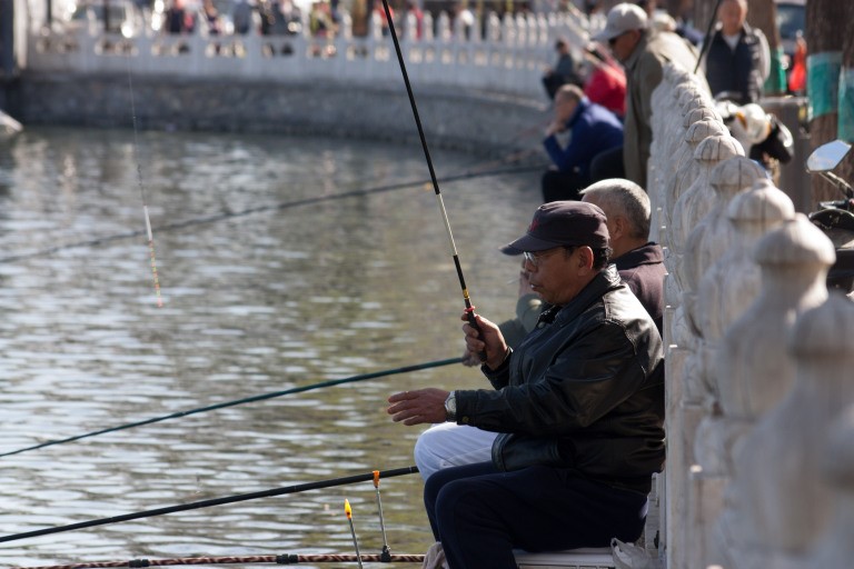 Many Chinese in Beijing love to fish during spring. Photo © Timothy Van Gardingen