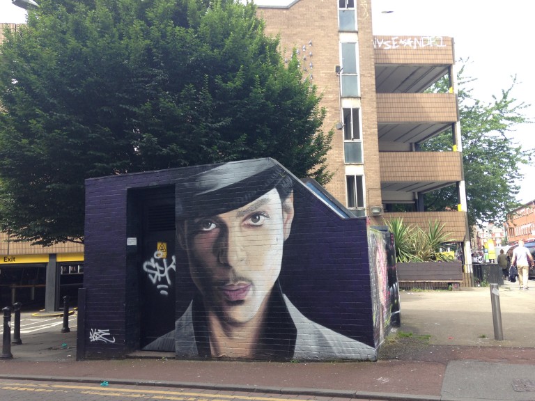 Memorial urban art depicting US pop star Prince on Tib Street, Manchester. Art by Akse. Photo: Ana Ribeiro