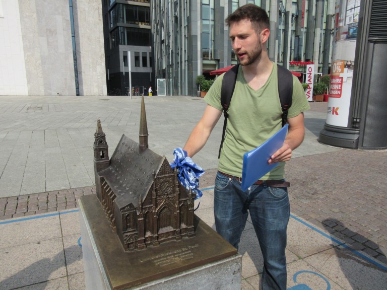 Matej tells us about the church that used to be where the uni is at Augustusplatz, Leipzig. (Photo: Ana Ribeiro) 