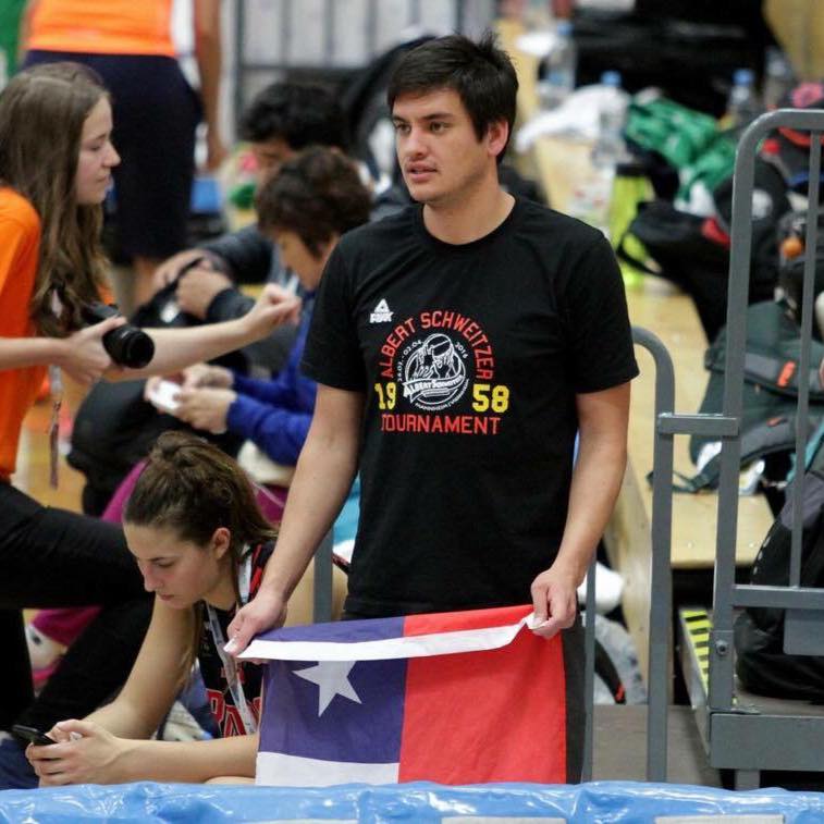 Sebastián Campos watches a young female player he trained in Chile play in a school-level world championship in Estonia. (Photo: Juan Pablo Perez Guerra)