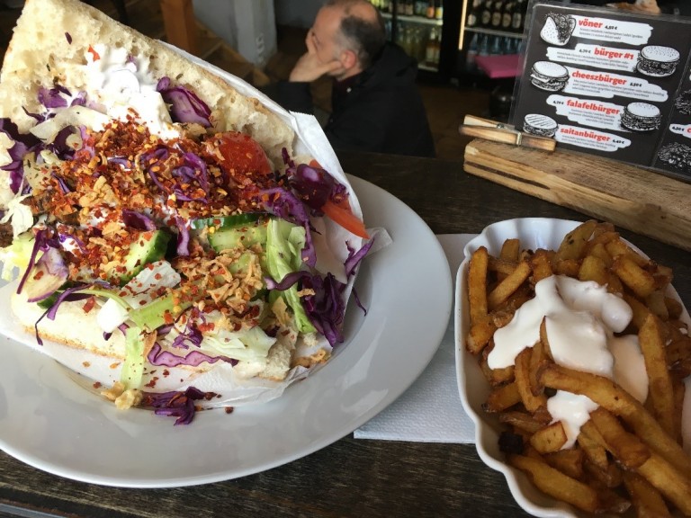 Vegan gyros sandwich with aioli, peanut sauce, salad and chips from Vlesicherei, Plagwitz. Goodbye hangover, hello food coma. Photo © Holly Doran