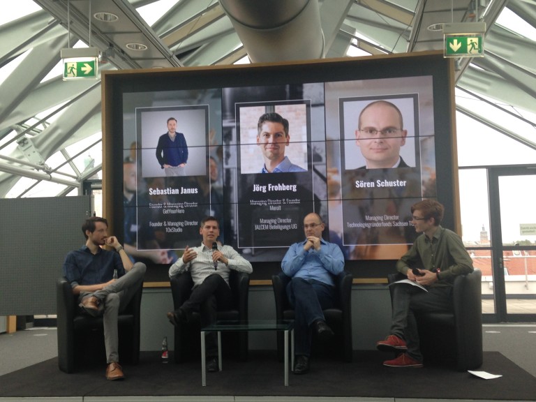 From left: Panelists Sebastian Janus (Founder of GetYourHero and 10XStudio), Jörg Frohberg (managing director of Merolt and JALCEM Beteilingungs), and Sören Schuster (managing director of Technologiegründerfonds Sachsen) debate the startup scene with Marco Weicholdt (managing director of Basislager Coworking) at Startup Safari 2018.