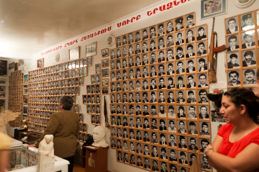 An exhibit in the Museum of Fallen Soldiers in Nagorno Karabakh showing pcitrues of fallen Armenian soldiers