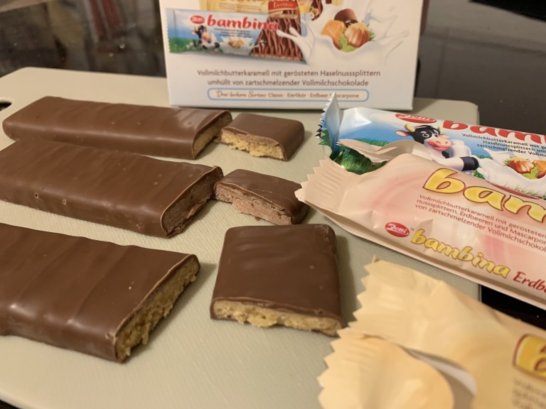 Several Bambina candy bar varieties cut open with wrappers