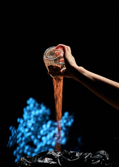 soil pouring from a glass