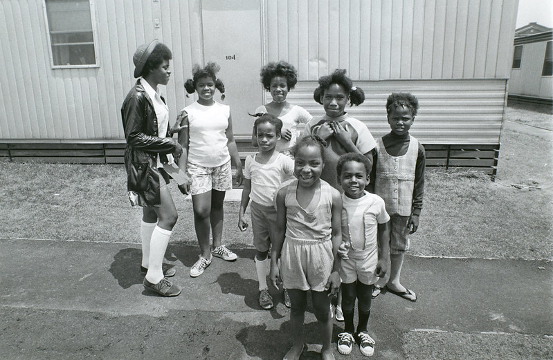 Children standing in front of building