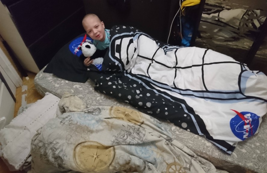 Boy on floorbed