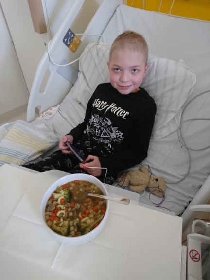 Boy in hospital bed