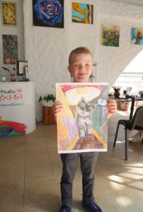 Boy holding art