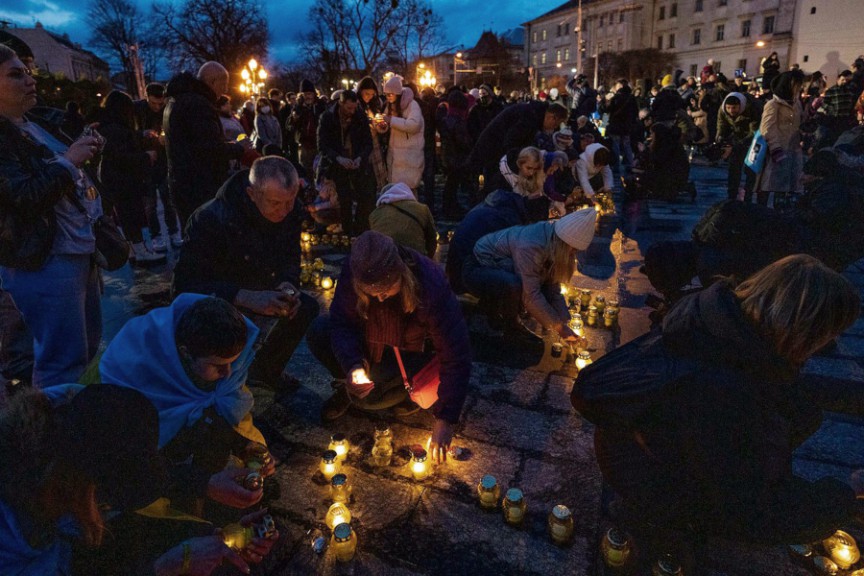 People placing candles