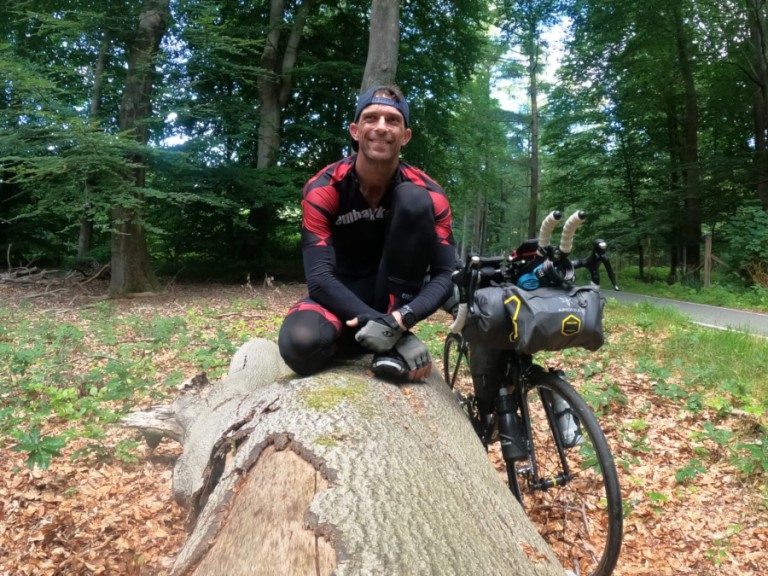 Smiling man with bike