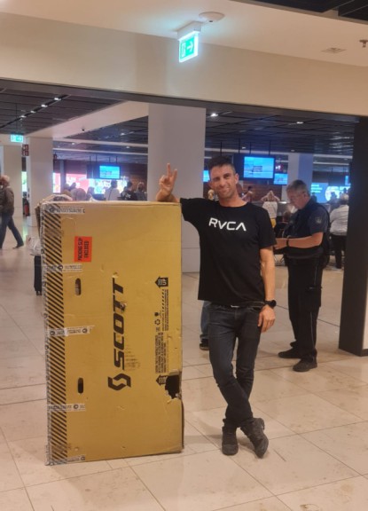 Man with bike box in airport