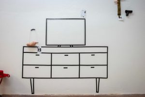 drawing of TV console on white wall