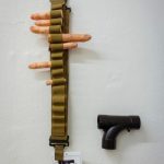 fake severed fingers in ammunition belt with toy gun
