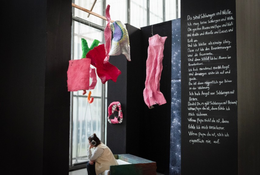 Hanging materials and child's writing on black board