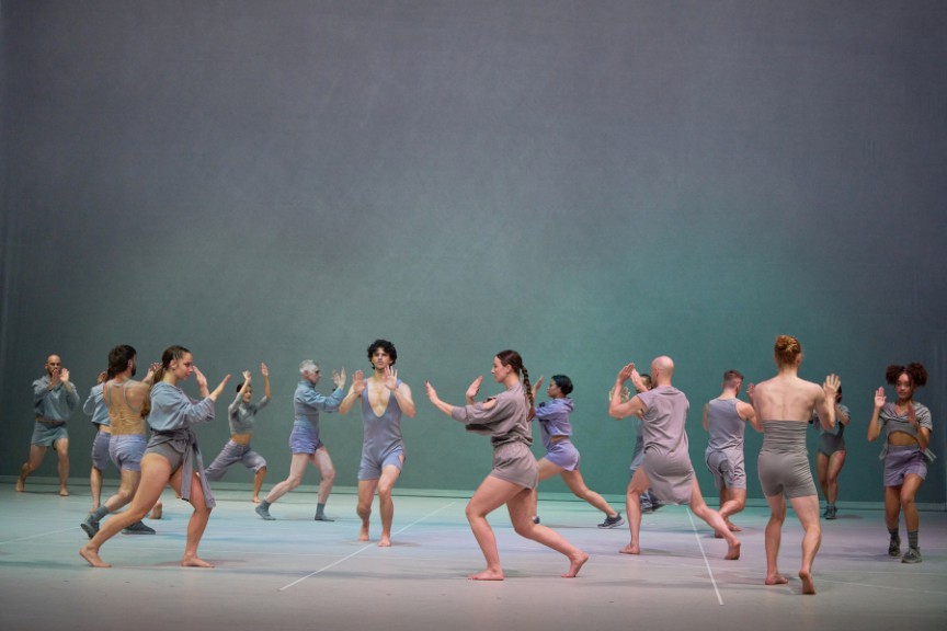 Dancers on stage in a circle