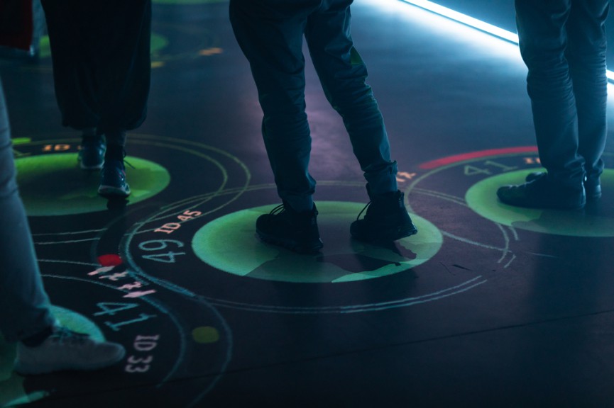 person's feet inside green light circle with numbering