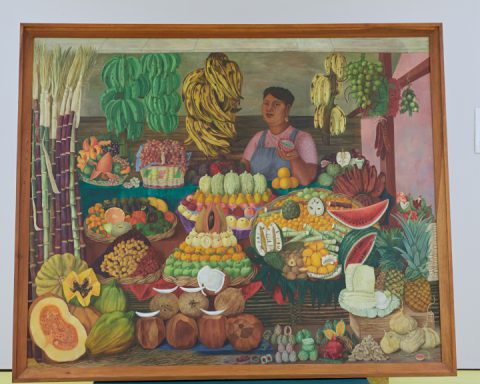 close up of colourful painting of fruit vendor